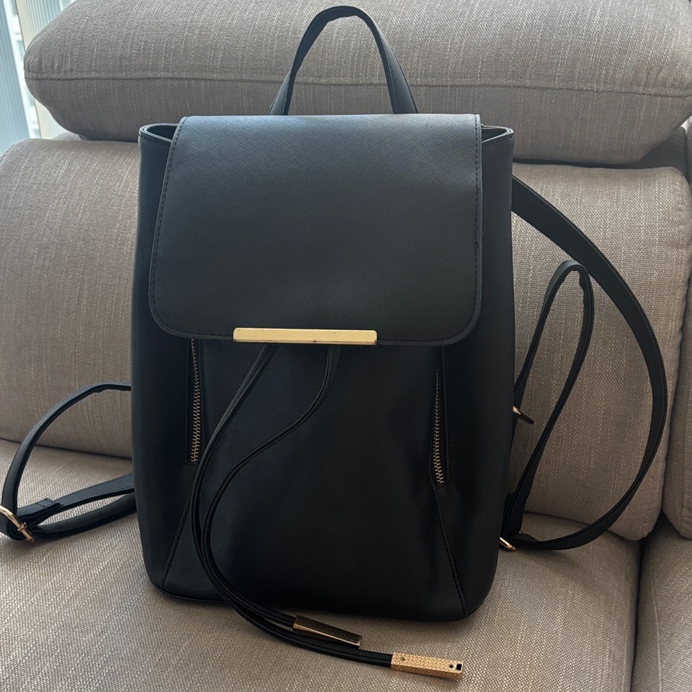 Elegant Black Backpack with Gold Details